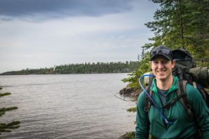 man along lakeshore